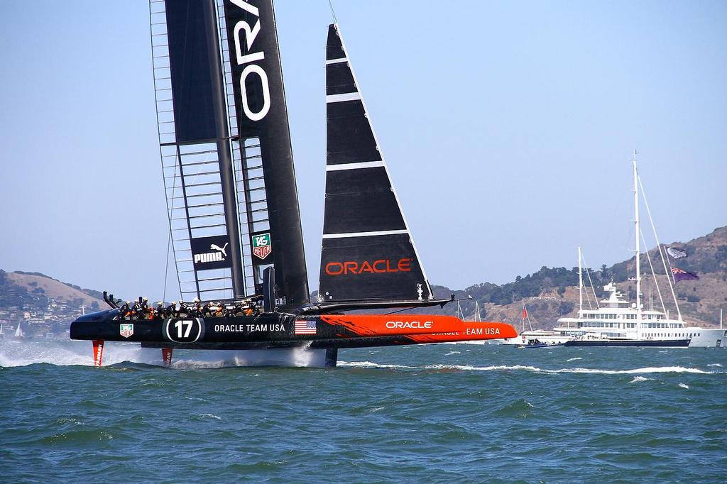 Oracle Team USA v Emirates Team New Zealand. America’s Cup Day 5 San Francisco. Oracle Team USA rounds Mark 1, Race 9 with Larry Ellison’s Rising Sun in the background © Richard Gladwell www.photosport.co.nz
